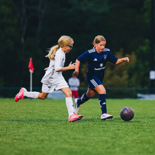 sporting city player challenging for ball during game
